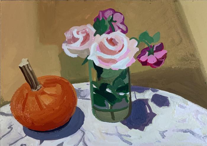 flowers in vase with pumpkin