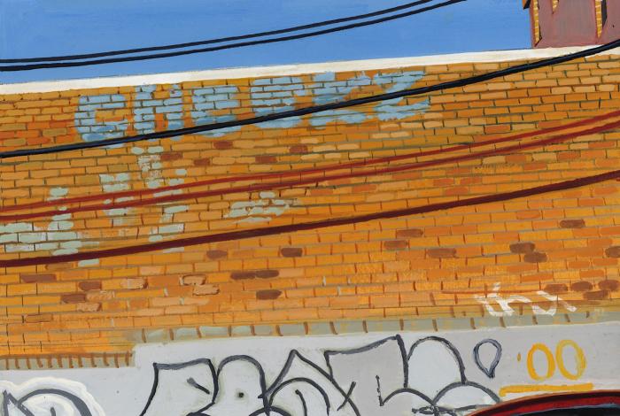 orange brick building and graffiti