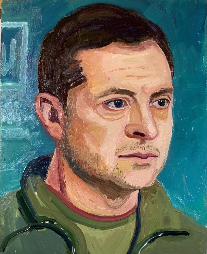 blue background 3/4 profile of Zelensky